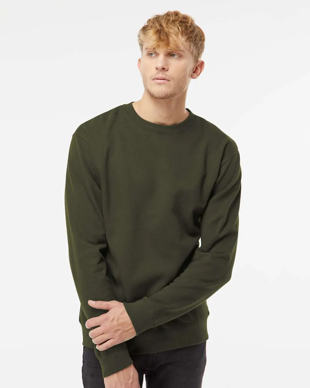 Model wearing an army green Independent Trading Co. SS3000 crewneck